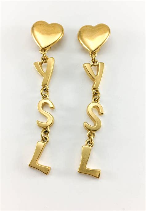 Yves Saint Laurent. Gold plated drop and dangle earrings 